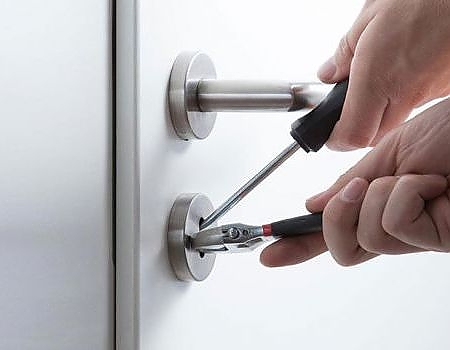 picking door lock with professional locksmith tools